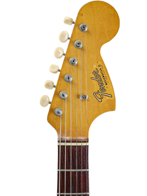 Classic 1966 Fender Musicmaster II guitar, beautifully displaying the iconic Stratocaster form and vintage charm.