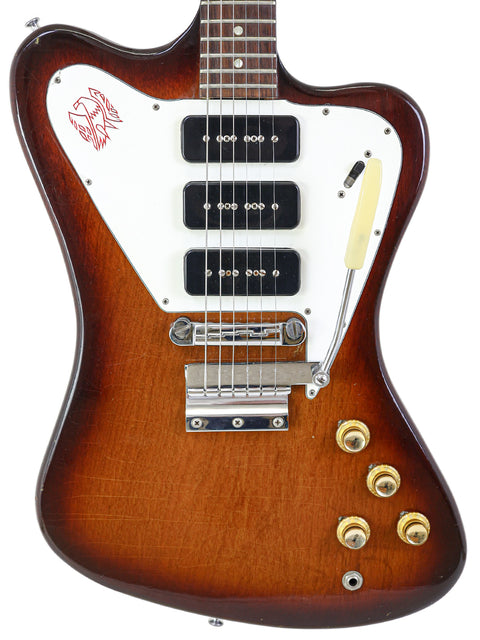 Classic 1966 Gibson Non Reverse Firebird III guitar with a brown body and contrasting white pickguard.
