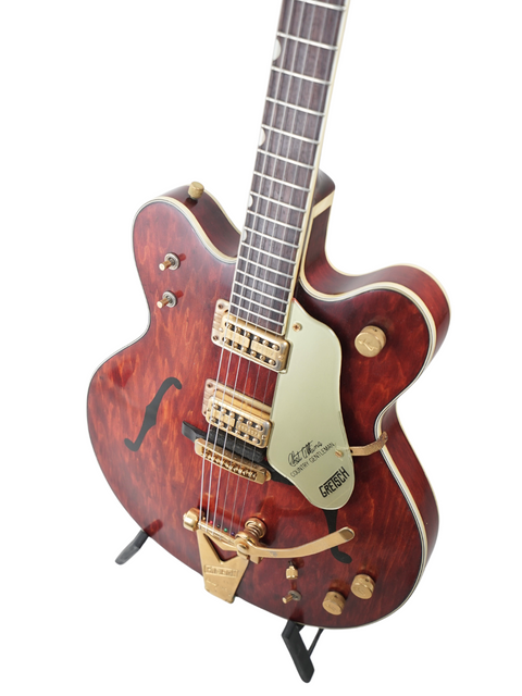 Classic 1967 Gretsch 6122 guitar with a wooden body and gold pick guard, representing timeless musical elegance.