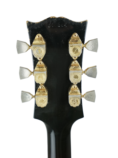 Close-up image of the headstock of a 1966 Gibson Johnny Smith guitar, highlighting its vintage craftsmanship and history.