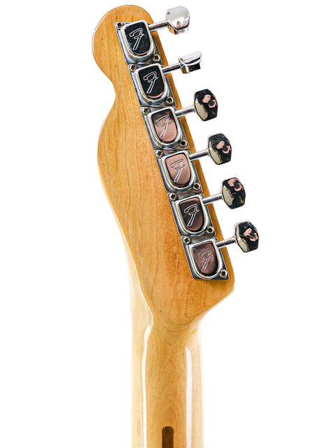 Close-up of a 1978 Fender Telecaster Custom electric guitar neck, showcasing its intricate details and craftsmanship.