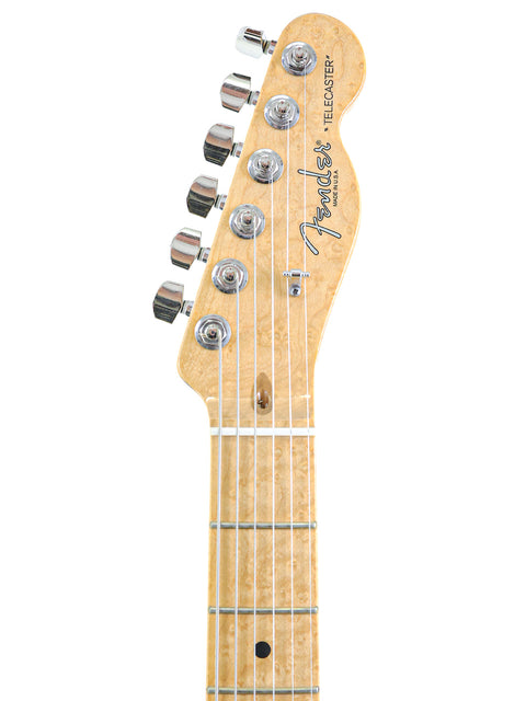 Close-up of a Fender Telecaster guitar headstock and neck, isolated on white.