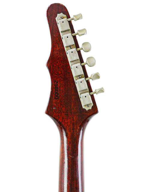 Close-up of a classic 1966 Epiphone Wilshire guitar head, emphasizing its elegant wooden body.