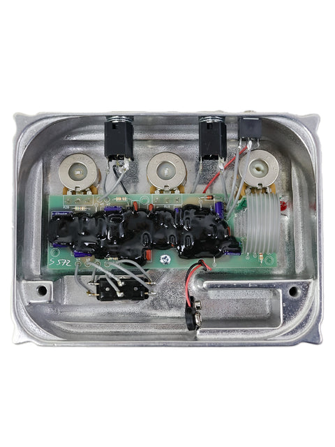 Close-up of a metal box filled with electronic parts, identified as Original Klon Centaur Silver "Non-Horsie," USA 1999.
