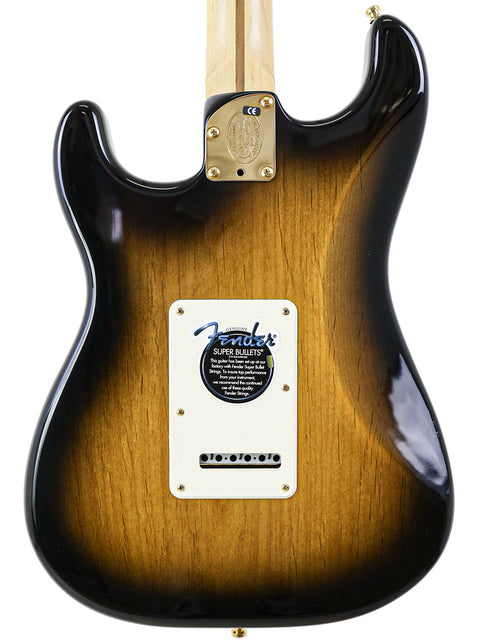 Close-up of a sunburst electric guitar body with neck plate and logo.