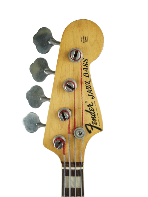 Close-up of a vintage 1972 Fender Jazz Bass, featuring its classic design and rich sunburst finish.