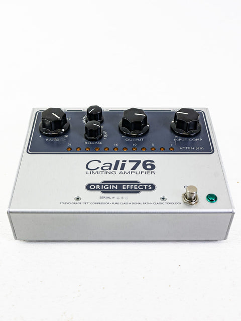 Close-up of the Origin Effects Cali76-TX compression pedal featuring the word "cal7" prominently displayed.