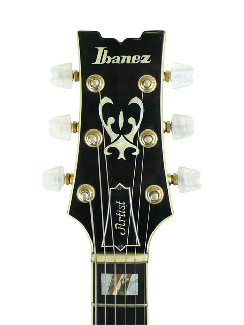 Close-up of the headstock of a 1979 vintage Ibanez Artist 2630 guitar, showcasing its logo.