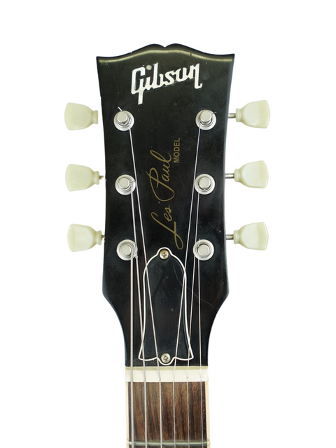 Close-up of the headstock on a Gibson Les Paul Standard 60s Slim Taper Neck, highlighting its classic features from 2005.
