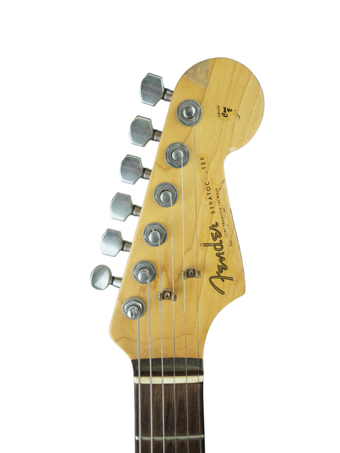 Close-up of the neck of a Fender Custom Shop Rory Gallagher Signature Stratocaster, showcasing its relic finish and craftsmanship.