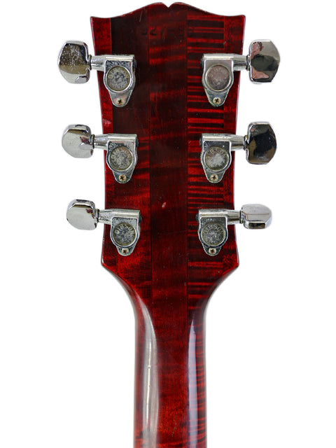 Close-up shot of the headstock on a 1968 Vintage Gibson Dove electric guitar, emphasizing its iconic style and quality.