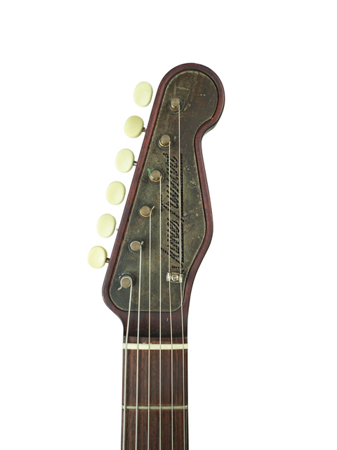Detailed view of a 2006 James Trussart Steelcaster guitar, highlighting the elegant wooden headstock and its unique features.