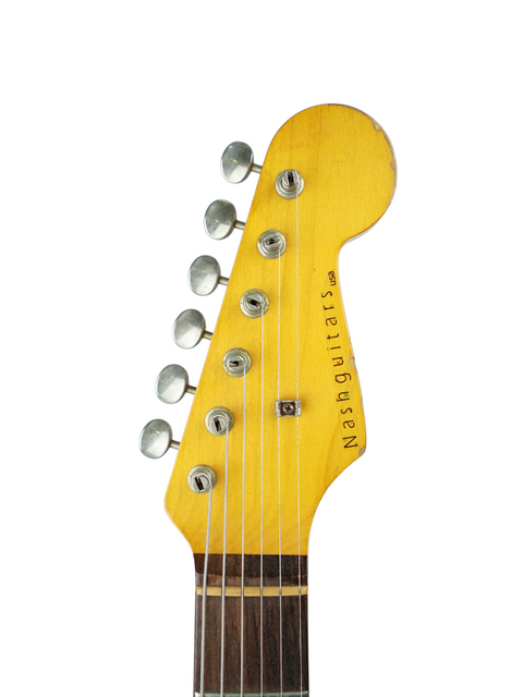 Detailed view of a yellow-bodied Nash S63 Stratocaster Relic guitar headstock, highlighting its craftsmanship from 2009.