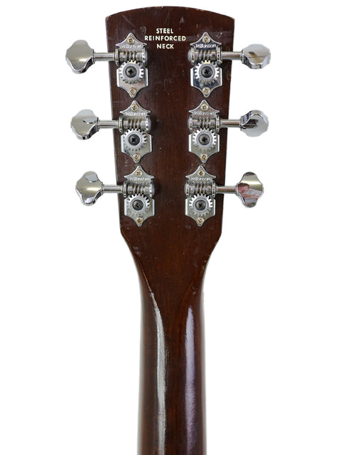  Detailed view of the headstock from a 1966-68 Kay K113 Parlour Guitar, highlighting its classic shape and tuning mechanisms.