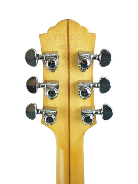 Detailed view of the headstock on a 1987 Guild D030A07 Dreadnought acoustic guitar, highlighting its classic design and quality.