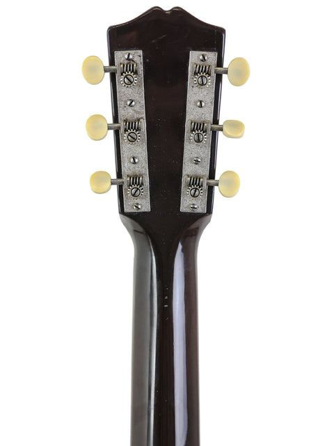 Detailed view of the headstock on a Gibson 30s L-00 True Vintage guitar, highlighting its elegant black body and vintage appeal.