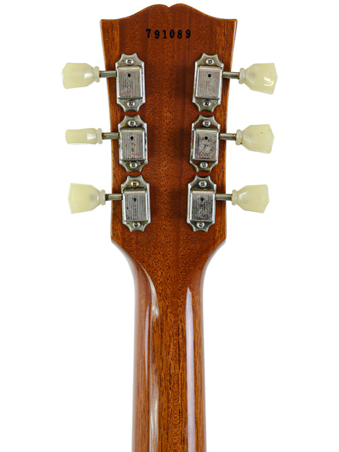Detailed view of the neck of a 2019 Gibson Custom Shop LPR-7 1957 Les Paul Goldtop with four control knobs.
