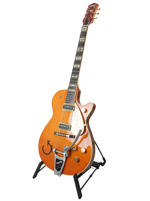 Eye-catching orange Gretsch Roundup 6121W Reissue guitar from Japan 2003, featuring a stylish black headstock for a classic look.