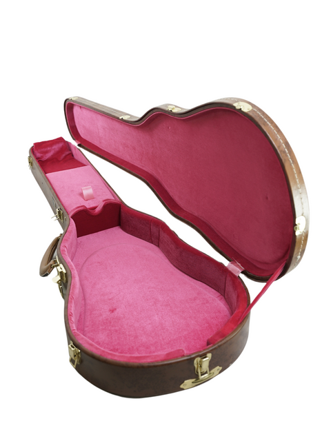 Eye-catching pink hardshell guitar case designed for Les Paul, featuring a soft cover for added protection and style.
