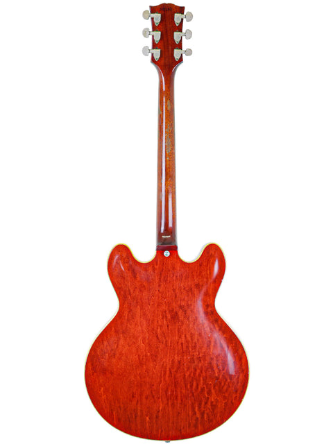 Eye-catching red Gibson ES-355 Stereo guitar, vintage 1967, displayed on a bright white background.