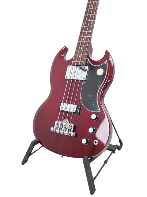 Eye-catching red electric bass guitar on a stand, the Gibson SG Standard Reissue from 2005, ideal for serious players.