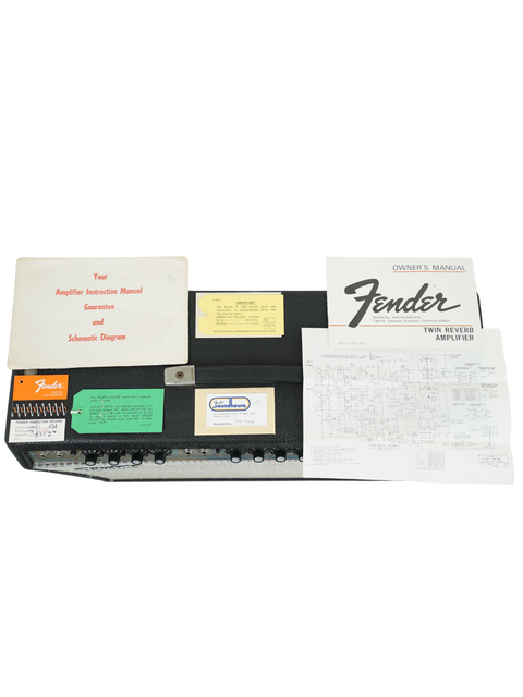 Fender Telecaster displayed with its original box and papers, next to a vintage 1974 Fender Twin Reverb 2x12" combo.
