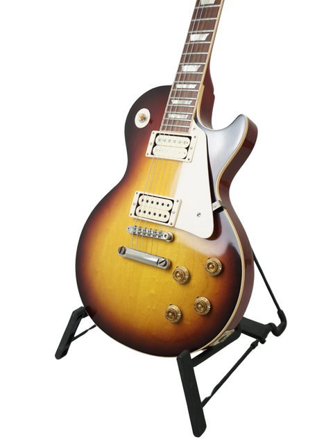 Gibson Custom LPR-8 '58 Les Paul Standard R/I displayed on a stand with a bright white backdrop.