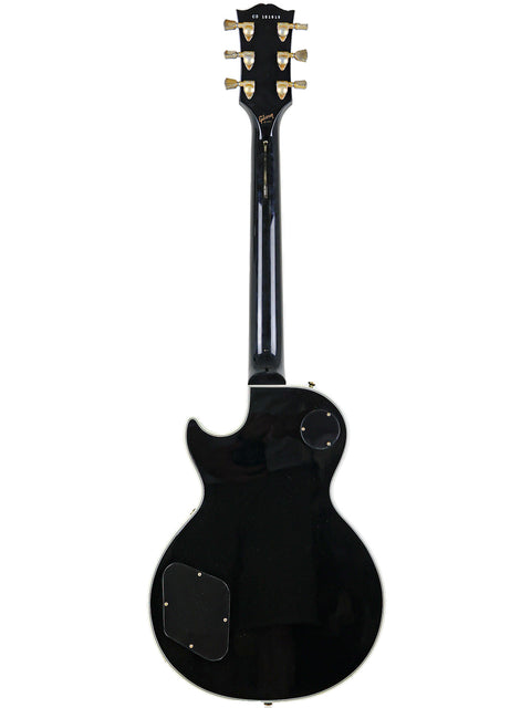 Gibson Custom Shop Les Paul Custom electric guitar in black with a white pickguard, made in the USA, 2010.