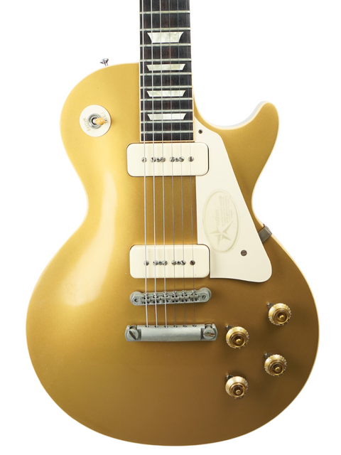 Gibson Les Paul Custom Goldtop guitar, 1956 Reissue, VOS finish, USA-made, showcasing classic design and craftsmanship.
