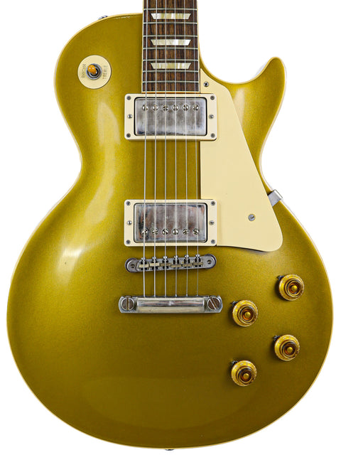 Gibson Les Paul Custom Goldtop guitar, 1957 reissue from the Custom Shop, USA, showcasing its iconic gold finish.

