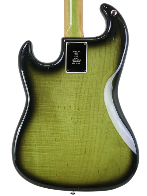 Green Fender American Standard Stratocaster displayed with a classic 1964 Vintage Burns Double Six 12-string guitar.
