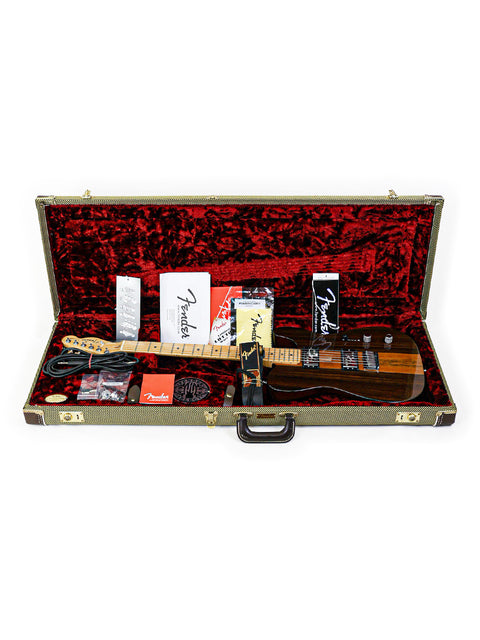 Guitar and accessories in open case with red lining.