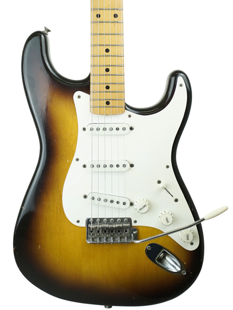 Iconic sunburst Fender Stratocaster, 1957 model with original case, a must-have for any serious guitar collector.