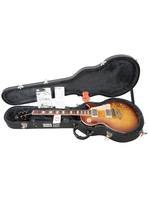 Inside a guitar case, a 2005 Gibson Les Paul Standard 60s with a slim taper neck, ready for performance or storage.