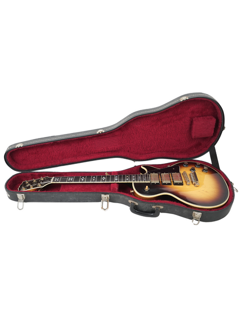 Inside a guitar case lies a vintage 1978 Gibson Les Paul Artisan, a testament to timeless musical artistry and design.
