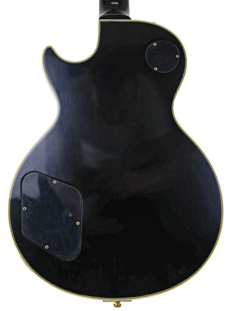 Limited edition 2008 Gibson Custom Jimmy Page Les Paul, showcasing a black body and a stunning gold pickguard.