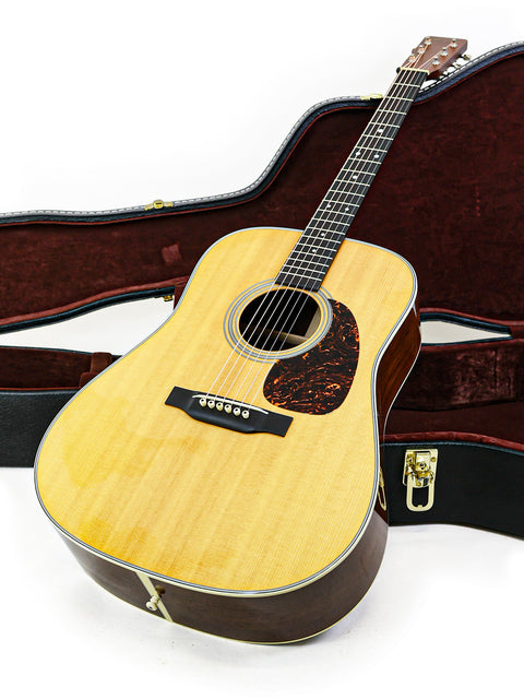 Martin D-28 CFM IV guitar in a case, showcasing its limited edition design from 2009, number 14 of 55.