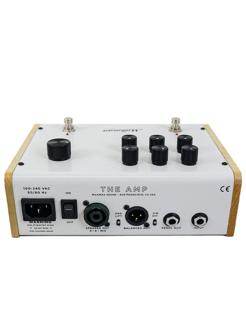 Milkman 'The Amp' is a wooden amplifier with four knobs, exemplifying fine craftsmanship from the USA.