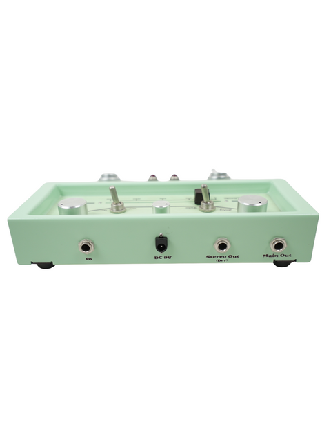 Mint green audio interface with knobs, switches, and input/output ports on front side.