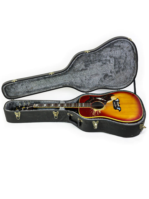 Open vintage Gibson Dove guitar case from 1968 on a white background, emphasizing its classic craftsmanship and design.