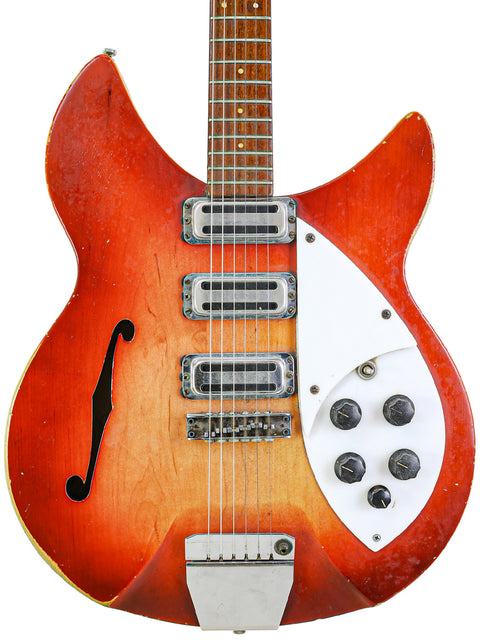 Orange-bodied Vintage Rickenbacker 1998 guitar with a white pickguard, model 345 Rose Morris from 1965.