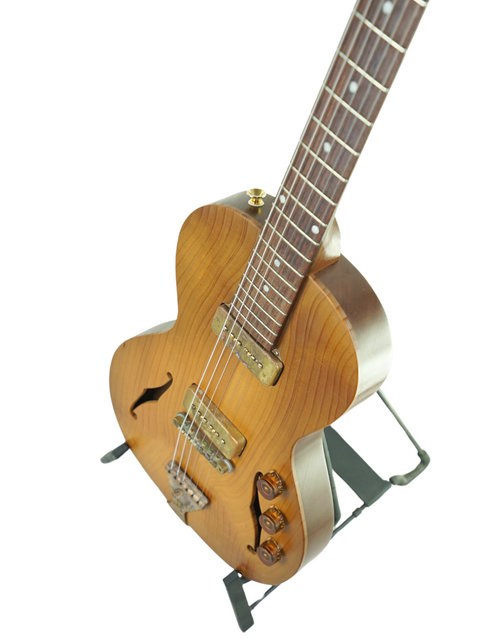 Perspective shot of B&G 'Little Sister' on a stand, emphasizing the guitar's boutique design and craftsmanship.