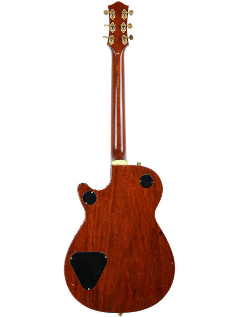 Rear perspective of a vintage Gretsch 6130 Roundup guitar, highlighting its wooden body from the USA, dated 1955.