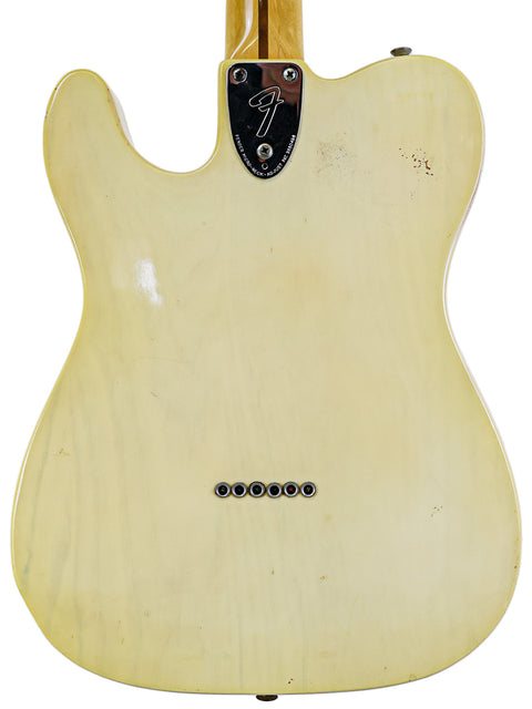 Rear perspective of a white 1978 Fender Telecaster Custom guitar, highlighting its iconic shape and craftsmanship.