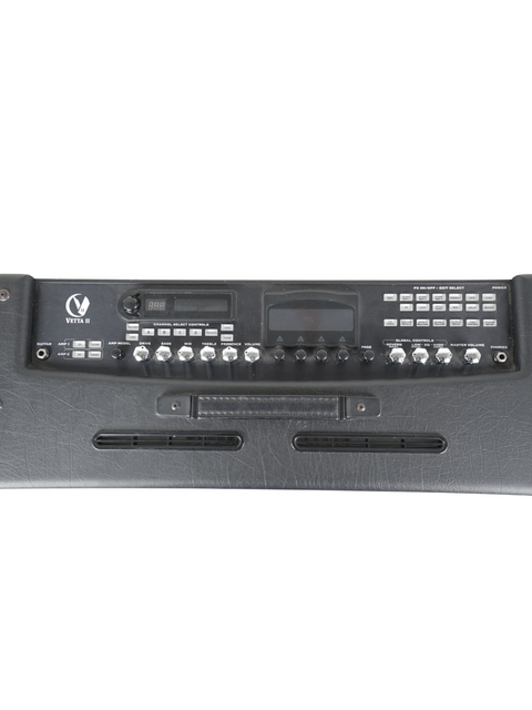 Rear side of a 2004 Line-6 Vetta II amplifier, showcasing a remote control for convenient operation.