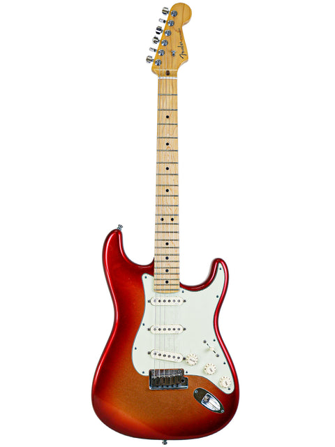 Red and sunburst electric guitar with a maple neck on a white background.