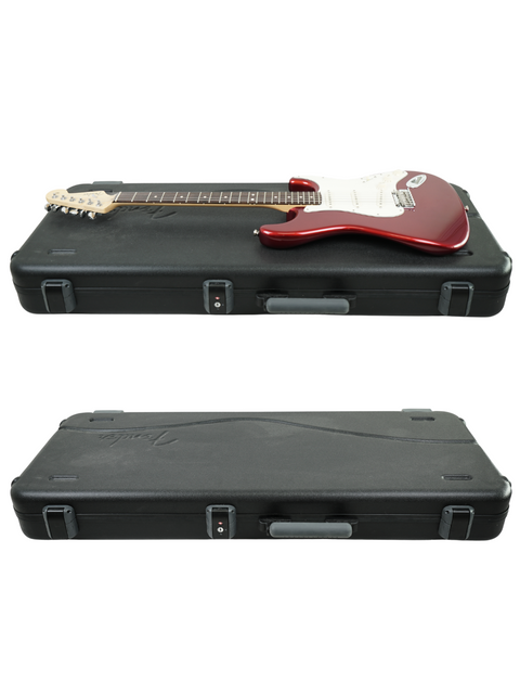 Red electric guitar on black case above a closed guitar case, on white background.