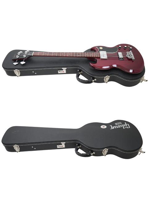 Showcase of two guitars with cases on a white background, including a 2005 Gibson SG Standard Reissue Bass, ideal for collectors.