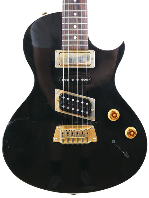 Stunning black Gibson Nighthawk electric guitar with gold hardware, perfect for musicians seeking quality and style.
