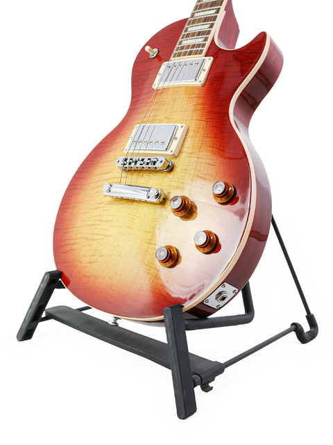 Stunning red and orange Gibson Les Paul Standard guitar displayed on a stand, highlighting its 2018 USA craftsmanship.